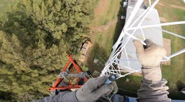 Worker Assembles Telecommunications Tower