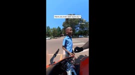 Schoolboy can't contain excitement after biker lets him rev motorcycle engine