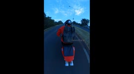 bikers' perform a hilarious synchronised head tilt while going around a corner.