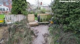 Homeowners left 'living on the edge of a cliff' after giant landslide destroys gardens