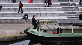 Griffin Number Two going past Freda on the Regents Canal, London, United Kingdom