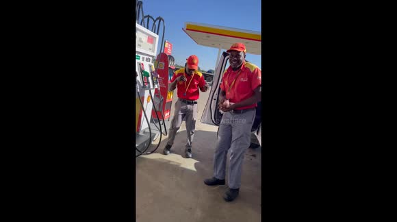 Dancing at a  service station staff in Namibia