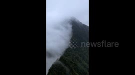 Spectacle of Rain Clouds Intercepted by Mountain Peaks in Guizhou, China