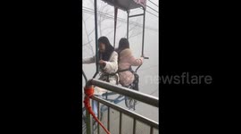Women on Aerial Cable Car in Yichang, China