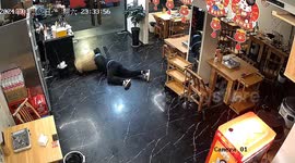 Hilarious moment Chinese restaurant worker takes a tumble into bamboo basket during celebratory dance