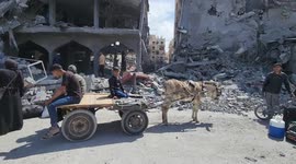 On-site in Gaza: Residents retrieve old memories on rubble of home