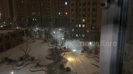 Family Enjoys Unconventional Skiing Pleasure in Heze, China