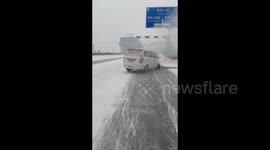 A man saves an unconscious driver from a burning van in Lanzhou, China