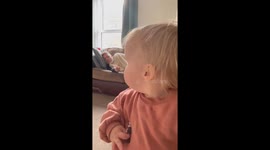 Slick toddler dethrones Edge as The Ultimate Opportunist by stealing snack off sleeping daddy