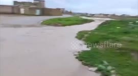 Floods flow in Al-Ayadiya district in Mosul after a wave of rain