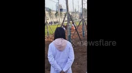 Students Attempt to Hold Cow in Tongren, China