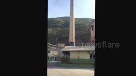 Two large smoke chimneys demolished with explosives in Jamaica