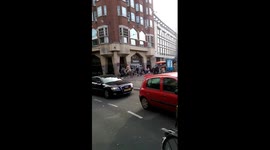 Half-naked horserider drags landsurfer on streets of Amsterdam