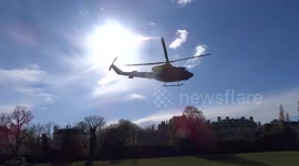 Helicopter is taking off the ground at Kensington Palace Gardens - London