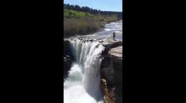 Daredevil jumps off massive waterfall