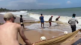 fisherman take out the big fishing net with the tourist sri lank