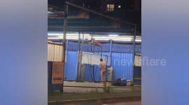 Naked man takes shower at car wash station in Taiwan