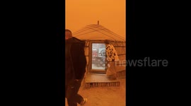 Chinese city shrouded in fiery orange as ferocious sandstorm strikes