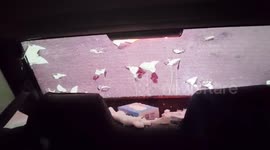 Massive hailstones demolish driver's rear windshield in China