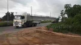 Bizarre double-faced trucks drive along busy road in Thailand