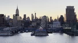 Sailing by the Chelsea Piers and Empire State Building in a Cruise Ship