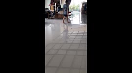 Father takes baby for a walk on rolling seat