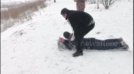 Unplanned duo ski ride ends in tumble in China