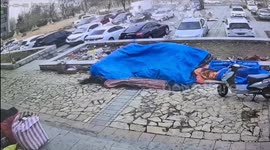 Strong winds peel off wall and damage cars in Chinese residential area