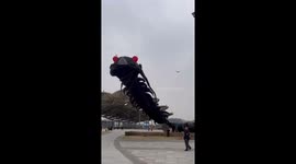 Senior citizen spotted flying giant kite shaped like centipede