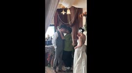 Photographer's Playful Pose Steals the Show at Chinese Wedding Shoot