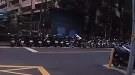 Woman knocks over row of parked motorcycles like dominos