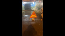 Tesco trolley comes to the aid of woman who doesn't want to walk through floodwater