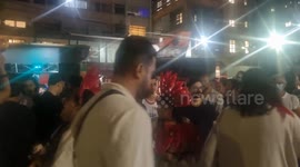 Demonstrators perform in the 