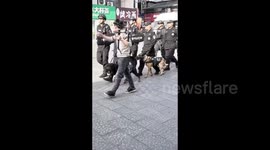 Police Corgi dog spotted to be carried on policeman’s back during patrolling in Shandong, China