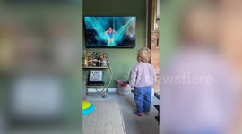 Tot perfectly mimics the poses of athletes from his favourite TV show - Gladiators
