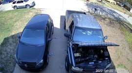 Truck rolls off driveway with mechanic working underneath