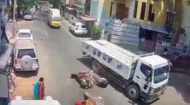 Bull HEAD BUTTS scooter rider in middle of road in south India