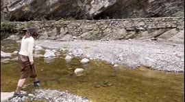 Woman Falls into Water During Crossing the River in Luzhou, China