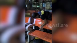 Drunk man rescued after getting head stuck in park bench in India