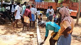 Youth climb a slippery pole in India as a part of the temple festival