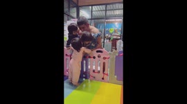 Dad has his hands full with three triplet babies