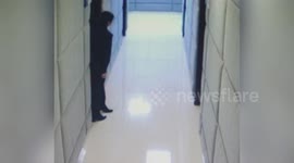 Policewoman stomps her feet outside interrogation room to vent anger