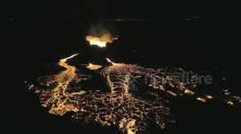 Aerial footage of stunning lava flow from Iceland volcano crater
