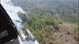 Guatemalan army helicopters battle forest fires plaguing the country