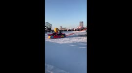 Excavator swings pendulum ride on ice in China