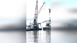 Salvage crews work to clear debris from collapsed bridge in Baltimore