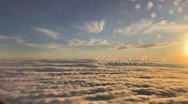 A sunset in the clouds over London. Is it an alien planet? No, just an amazing glimpse of soft, fluffy world in the sky.
