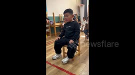 Hilarious moment Chinese toddler nods off five times in 15 seconds during class