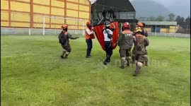 Emergency Team Filling Helicopter Water Basket for Forest Fire Combat in Guatemala
