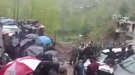 Cars stuck on inundated road due to heavy rainfall in northern India
